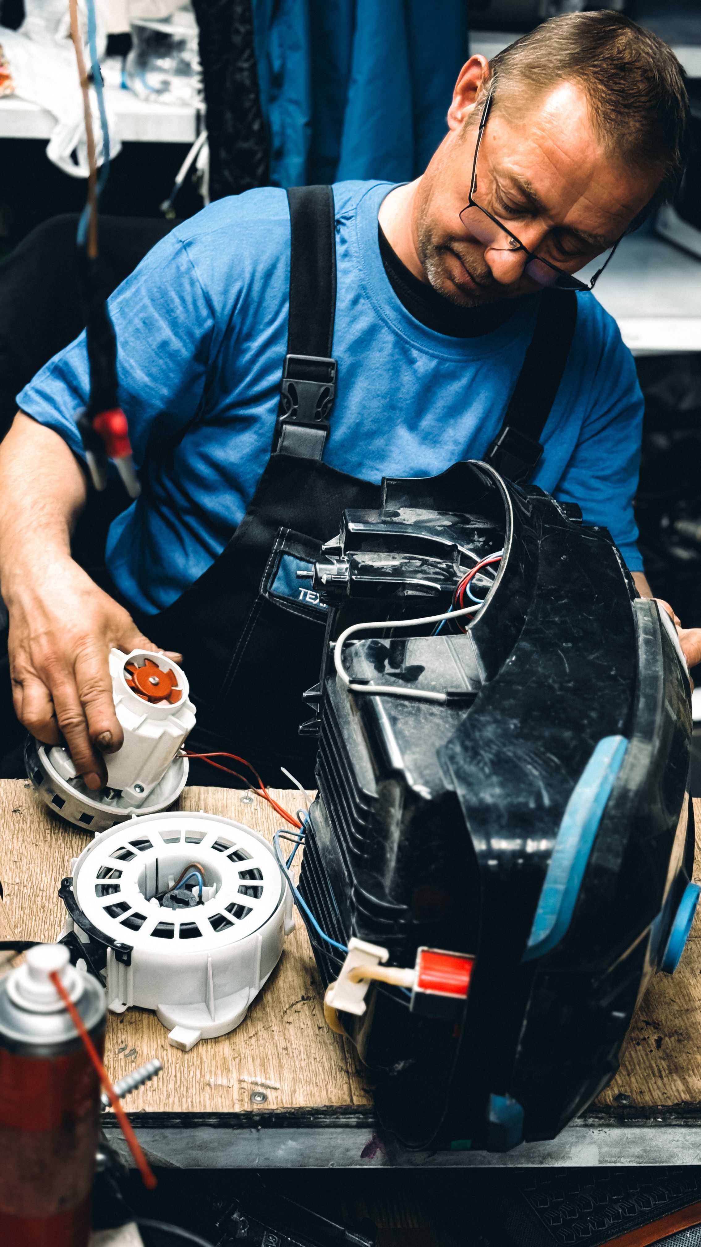 Professional appliance repair technician at work